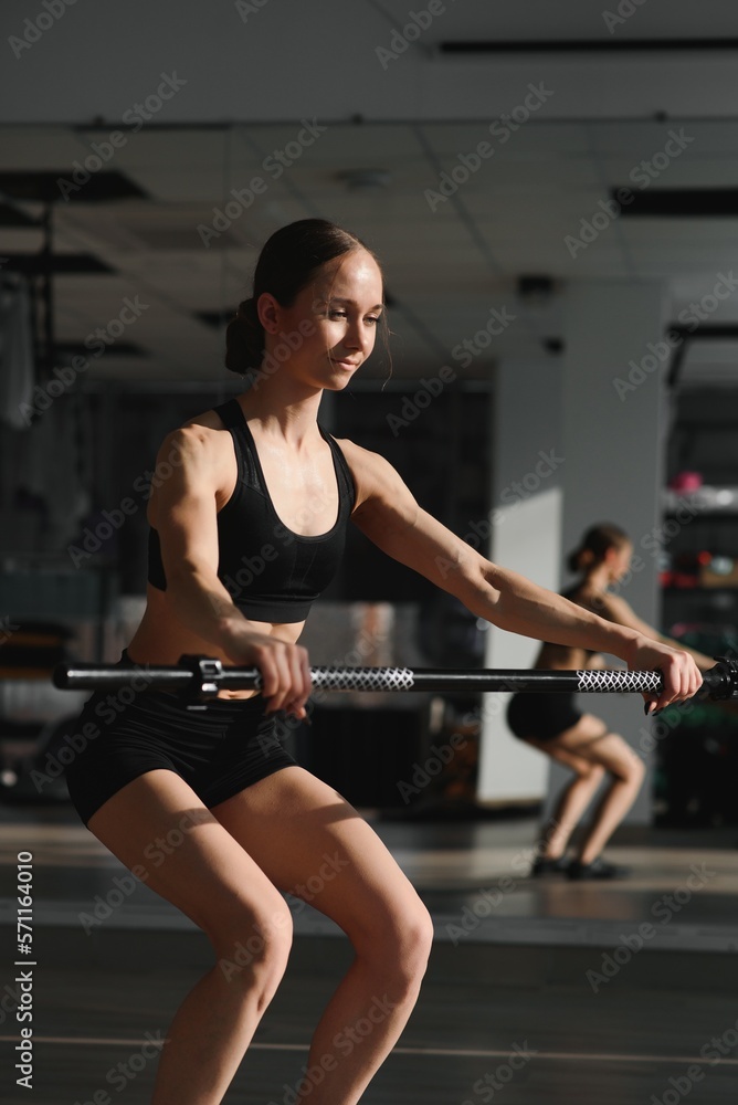 Sports. Woman at the gym doing stretching exercises. Sports. Woman at the gym doing stretching exercises.