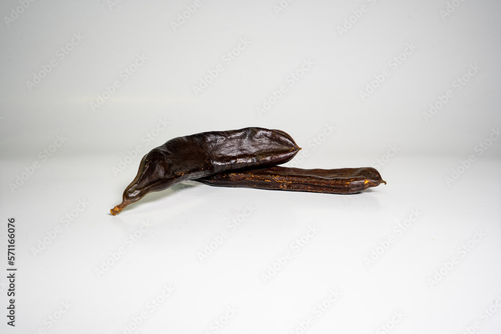 Photo of vegetarian cocoa with carob isolated on white background Photo of vegetarian cocoa with carob isolated on white background