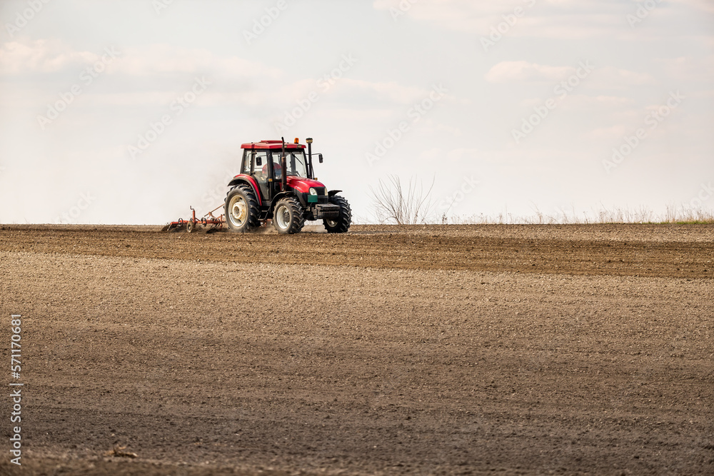 The dance of the tractor, cultivating the land in anticipation of new growth The dance of the tractor, cultivating the land in anticipation of new growth