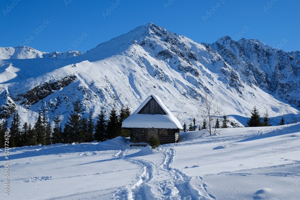 Beautiful winter scenery of Hala Gasienicowa (Valley Gasienicowa) withshepherd's hut in Tatras Mountains, Zakopane, Poland, Tatra National Park. 