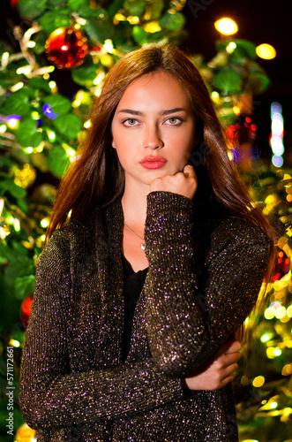 female with a christmas background, christmas fashion, brown hair fema