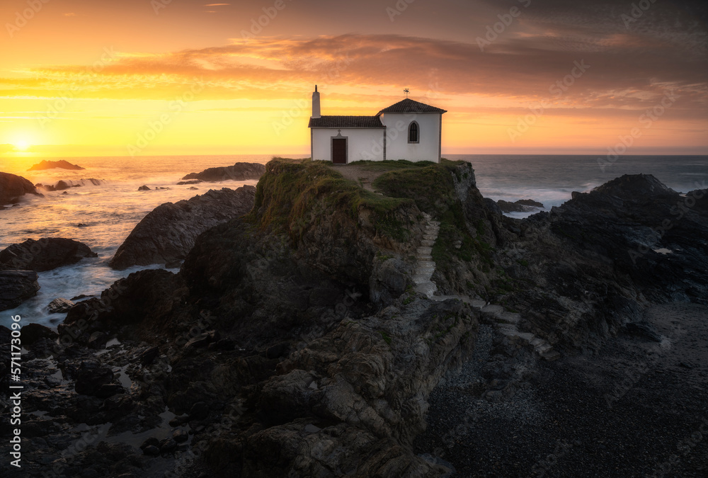 Beautiful hermitage at sunset on the coast of Galicia