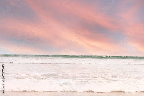 Pink sunset over the ocean waves