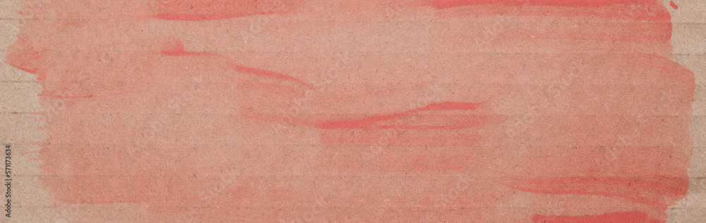 Fototapeta premium Horizontal background. Cardboard with paint streaks in faded red. Design space.
