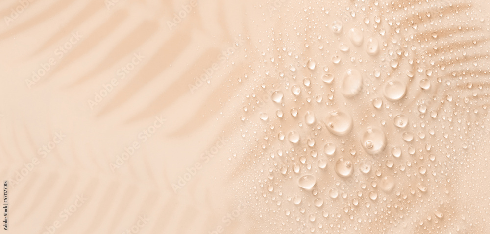 banner drops on a pastel beige background with place for text - obrazy, fototapety, plakaty 