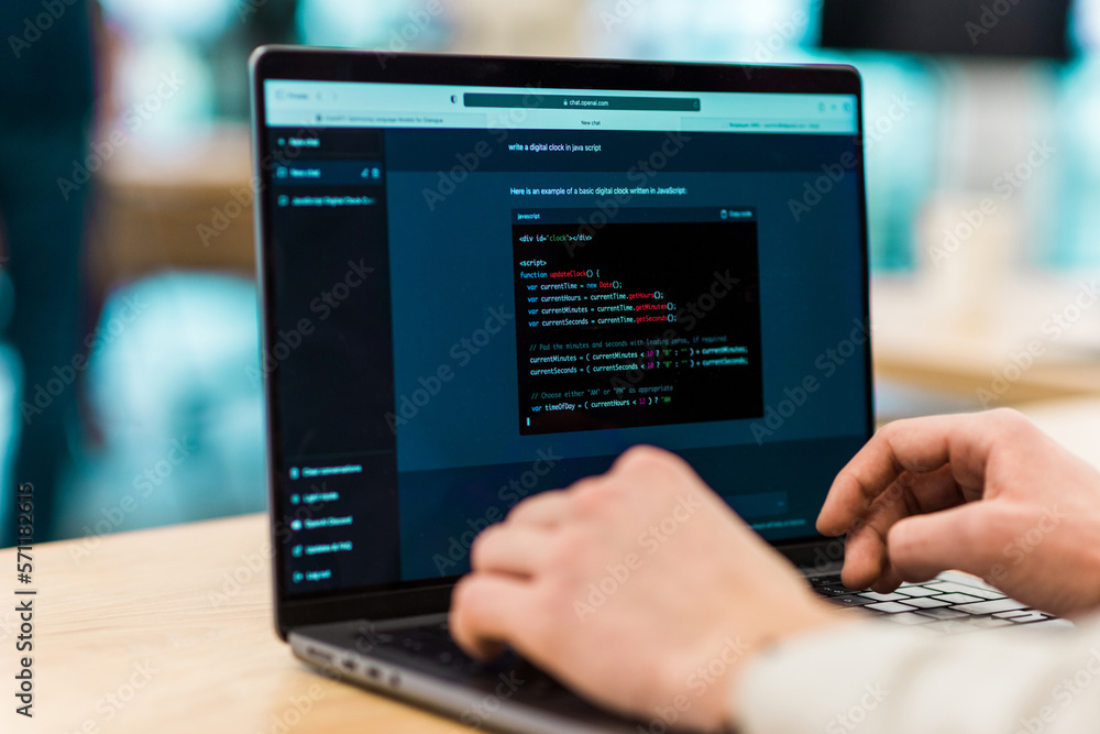 Close view of a software developer generating code in an AI chat by giving a request Close view of a software developer generating code in an AI chat by giving a request