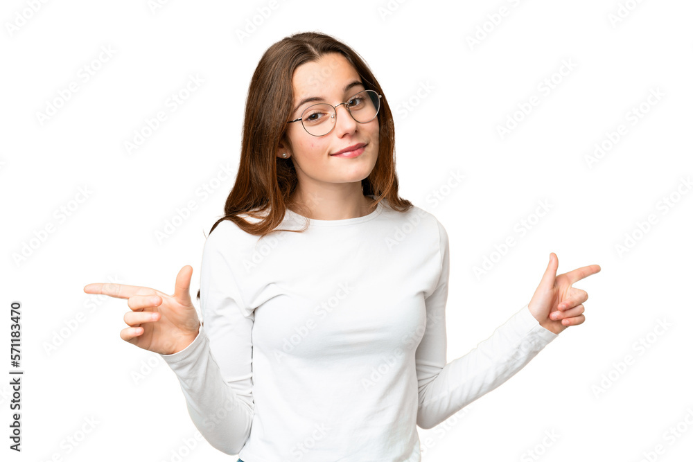Teenager girl over isolated chroma key background pointing finger to the laterals and happy Teenager girl over isolated chroma key background pointing finger to the laterals and happy