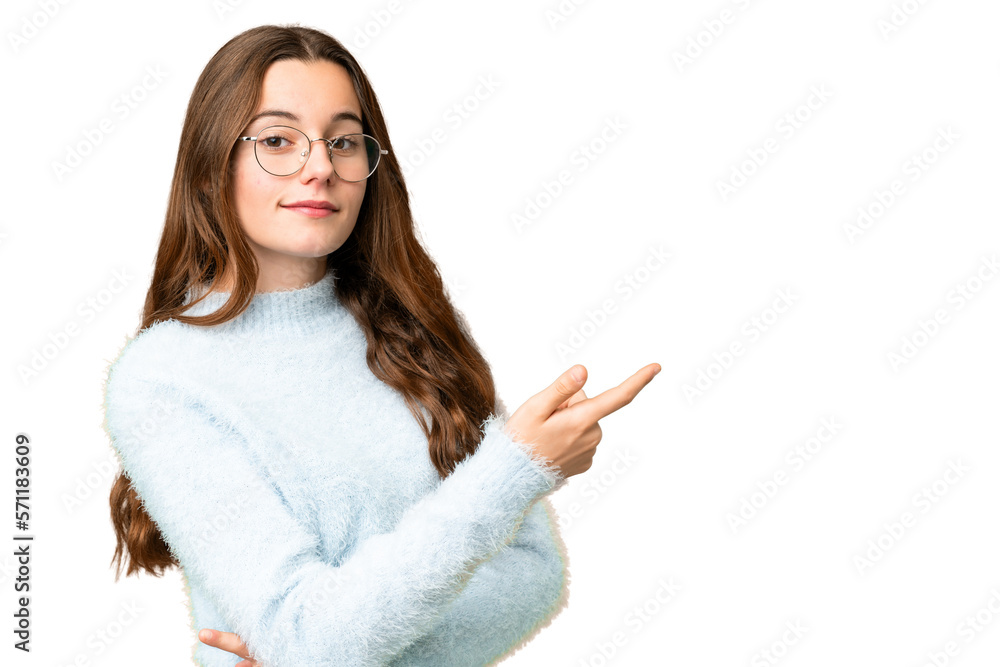 Teenager girl over isolated chroma key background pointing finger to the side