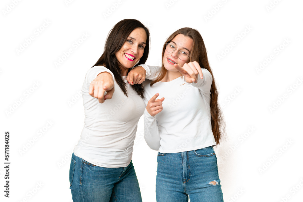 mother and daughter over isolated chroma key background points finger at you with a confident expression mother and daughter over isolated chroma key background points finger at you with a confident expression