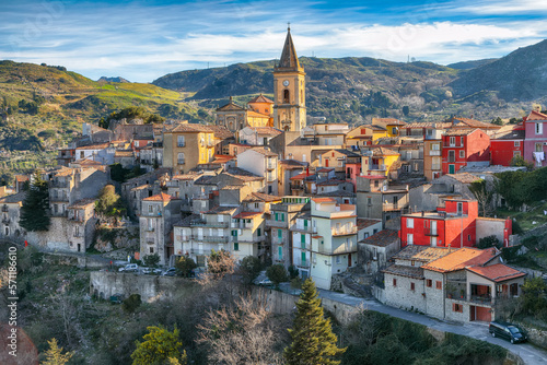Φωτογραφία Amazing Panorama of the belltower and the village in the valley at early sunrise