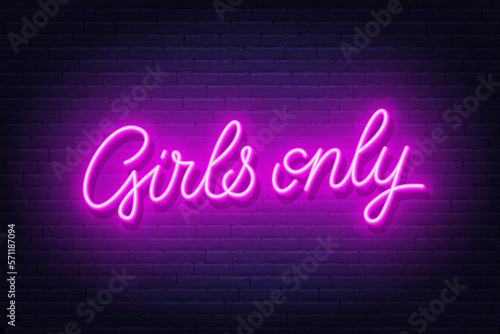 Girls Only neon sign on brick wall background.