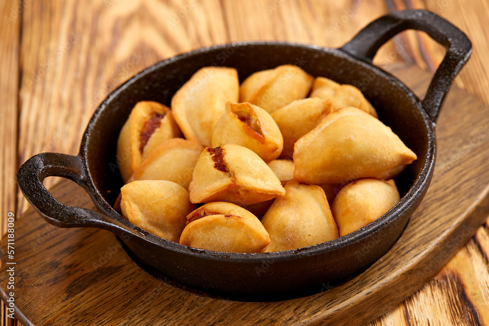 fried dumplings on the wooden background fried dumplings on the wooden background