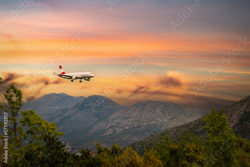 Airplane landing in Dubrovnik airport (Cavtat) on a sunset time.