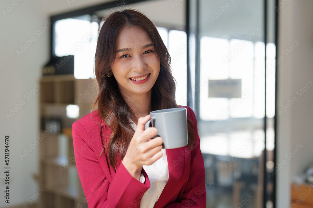 Beautiful asian business woman working on a laptop at office. Financial analysis and tax concept Beautiful asian business woman working on a laptop at office. Financial analysis and tax concept