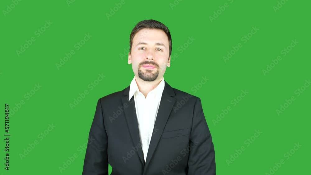 Young elegant businessman crossing his arms on a green screen background. This footage is the perfect addition to any business-themed project, showcasing a confident and determined attitude. Young elegant businessman crossing his arms on a green screen background. This footage is the perfect addition to any business-themed project, showcasing a confident and determined attitude.