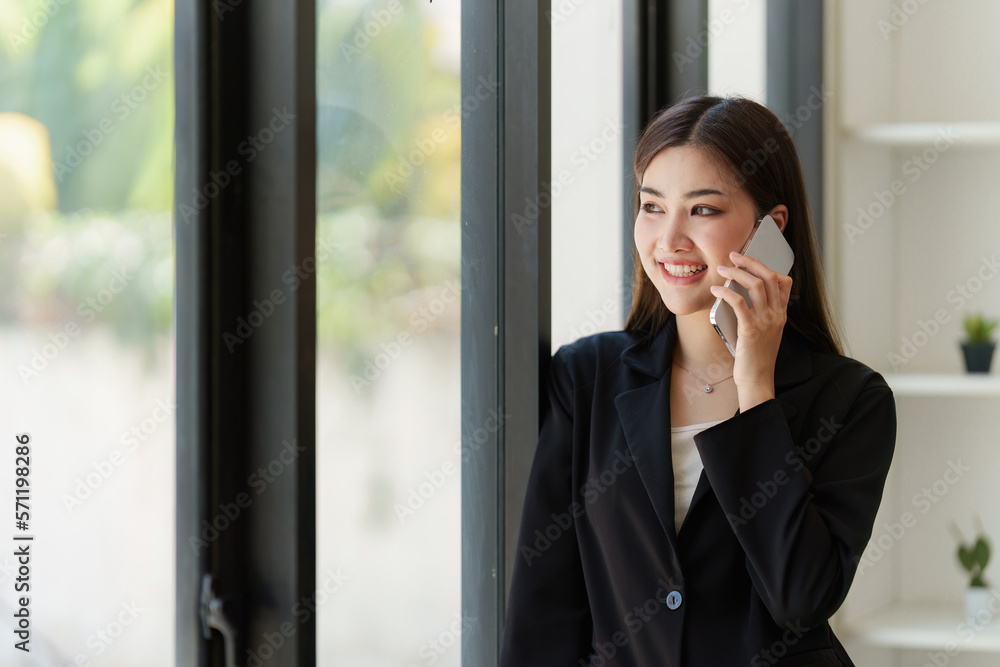 Beautiful asian business woman talking with customer at office. Financial analysis and tax concept Beautiful asian business woman talking with customer at office. Financial analysis and tax concept