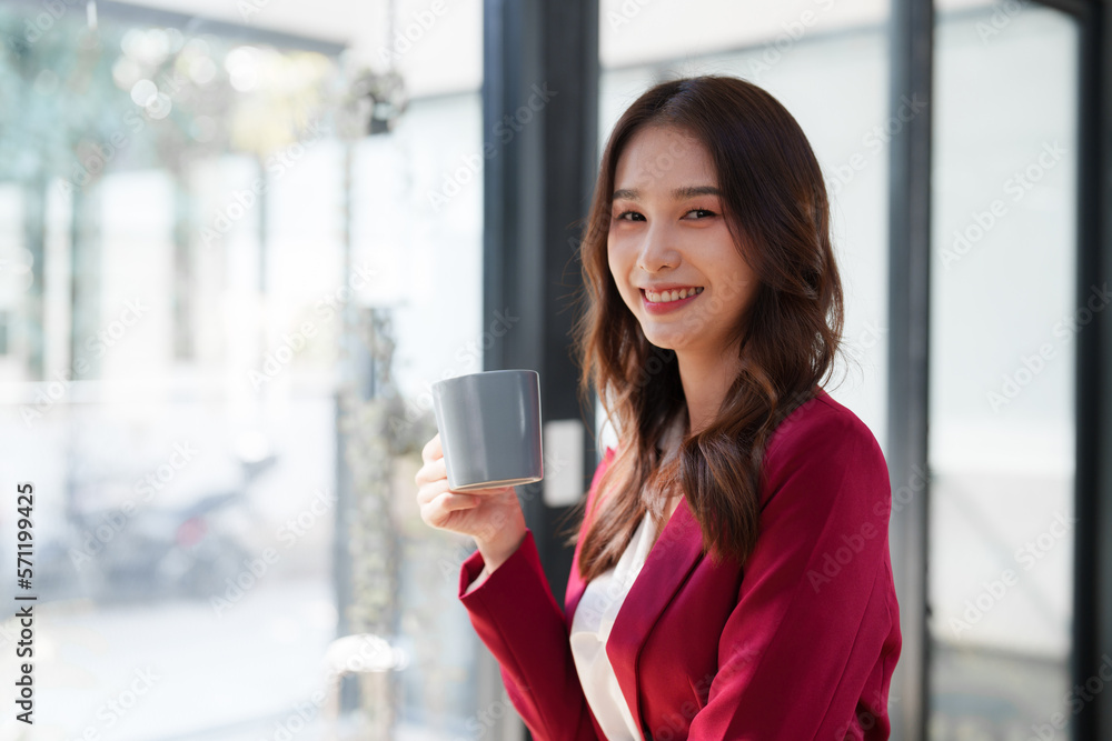 Beautiful asian business woman working on a laptop at office. Financial analysis and tax concept Beautiful asian business woman working on a laptop at office. Financial analysis and tax concept
