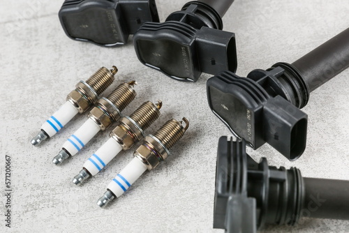 spark plugs and ignition coils top view. new car parts close up. 