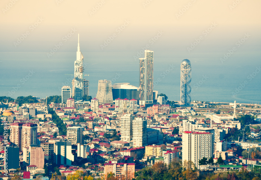 Birds eye view of Batumi city tourist attractions and stunning design architecture buildings with setting sun background, Travel destination in Georgia