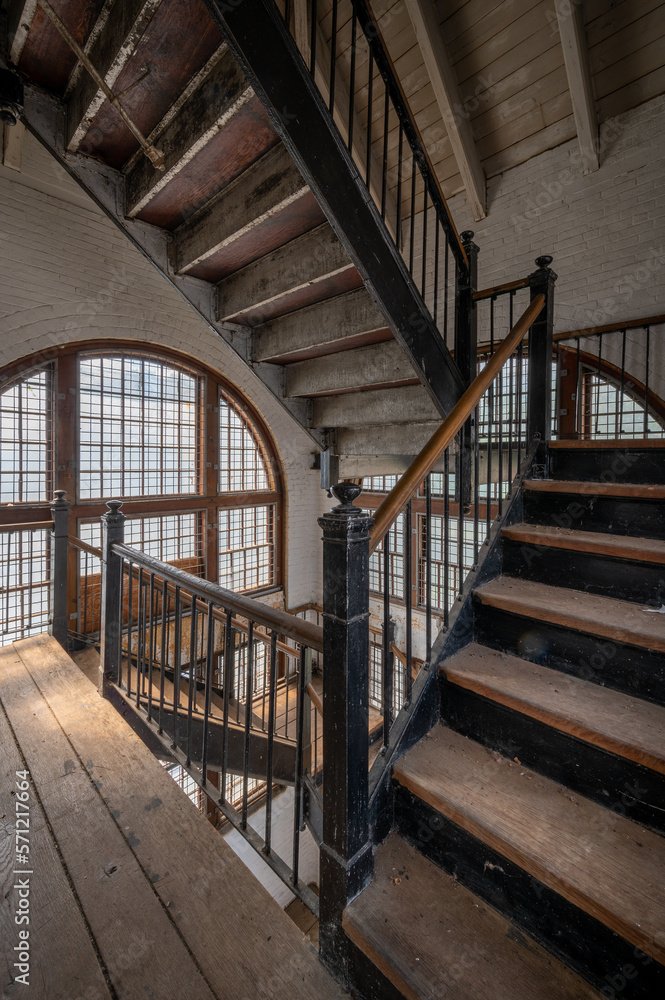 A maze of stairs and glass in an abandoned hospital