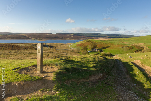 Walking guide post or waymarker at Llyn Brenig reservoir in the Denbigh moors for the archaeological trail allowing visitors locate bronze age monuments in the area east of the reservoir