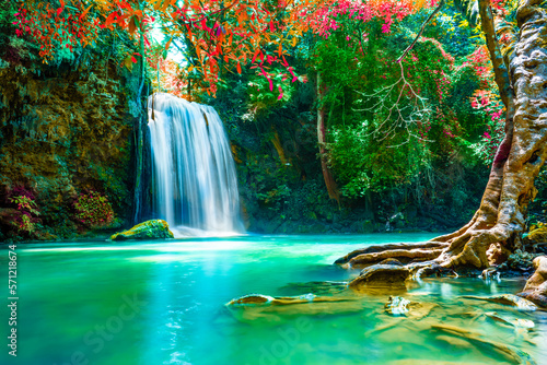 Fototapeta Naklejka Na Ścianę i Meble -  Waterfalls in the emerald blue water in Erawan National Park. Erawan Waterfall is a beautiful natural rock waterfall in Kanchanaburi, Thailand.Onsen atmosphere.