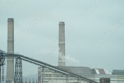The chimney of a thermal power plant, the smoke extracted by a thermal power plant on the chimney, in the production process. Environment. Pollution.