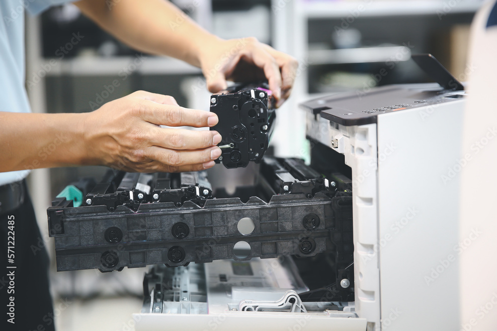 Technician hand open cover printer photocopier or photocopy to replace ink cartridges or fix paper jam for scanning fax or copy document in office workplace. Technician hand open cover printer photocopier or photocopy to replace ink cartridges or fix paper jam for scanning fax or copy document in office workplace.
