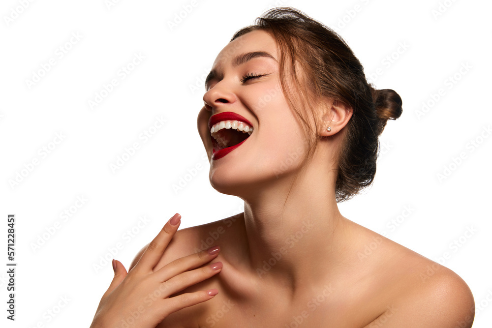 Dental care, teeth whitening. One beautiful brunette girl with red lips makeup smiling. posing against white studio background. Concept of natural beauty, youth, health, wellness, femininity, make-up Dental care, teeth whitening. One beautiful brunette girl with red lips makeup smiling. posing against white studio background. Concept of natural beauty, youth, health, wellness, femininity, make-up
