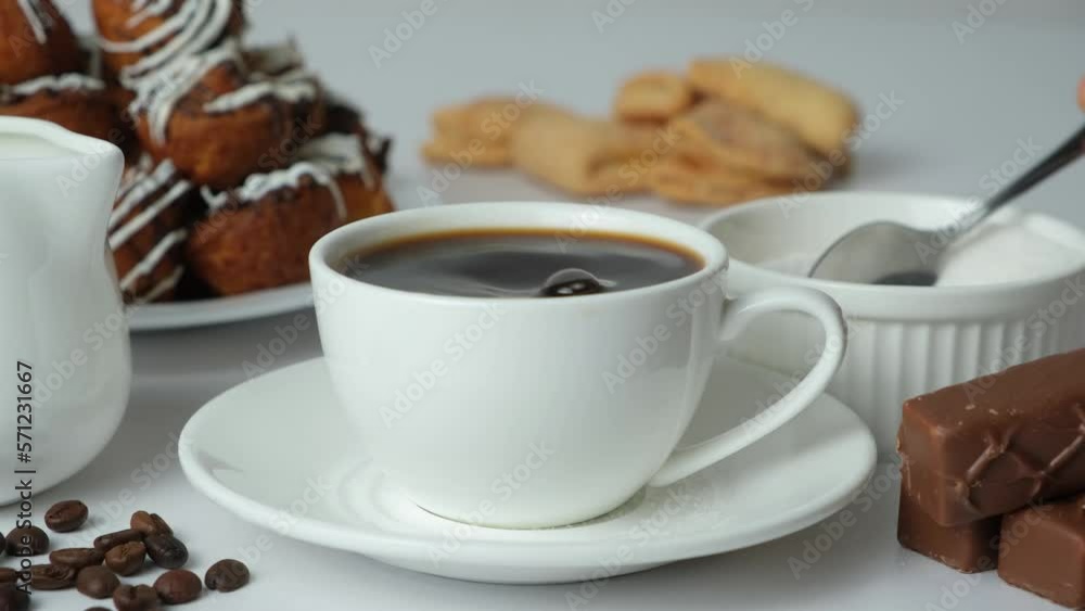 The process of pouring many spoonfuls of sugar in coffee, sugar addict, diabetes, glucose. The process of pouring many spoonfuls of sugar in coffee, sugar addict, diabetes, glucose.