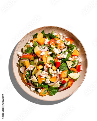 Isolated summer peach and cheese salad with mint, top view