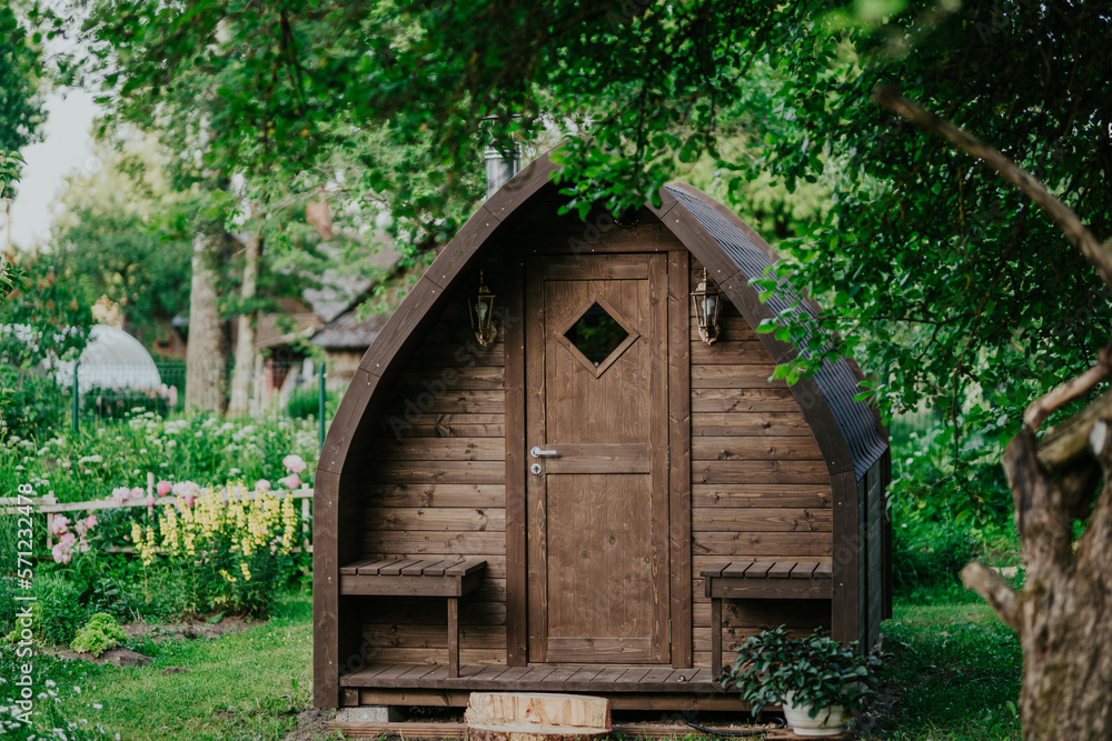 outdoor wooden barrel sauna in the garden outdoor wooden barrel sauna in the garden