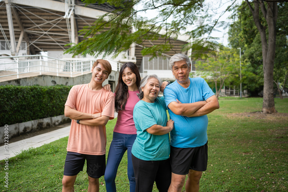 Healthy family group instructors workout in fresh air, and they rest and stand together after morning exercises in park. Outdoor activities, healthy lifestyle, strong bodies, fit figures, health care. Healthy family group instructors workout in fresh air, and they rest and stand together after morning exercises in park. Outdoor activities, healthy lifestyle, strong bodies, fit figures, health care.