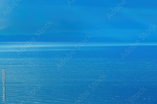 Morning sunlight beaming through clouds at Kvarner gulf of Adriatic sea in Croatia