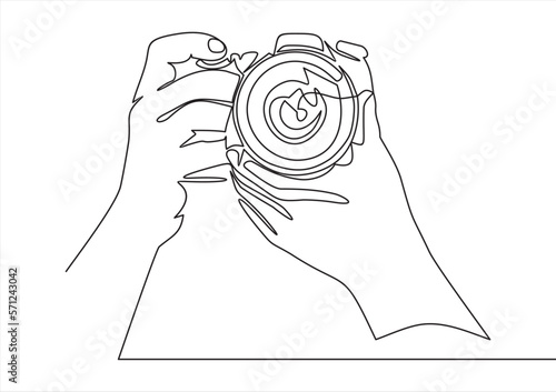 continuous line drawing of hand holding photo camera making pictures