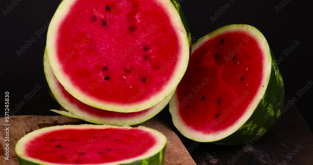 Ripe red watermelon with black seeds, ripe and sweet red watermelon cut into pieces Ripe red watermelon with black seeds, ripe and sweet red watermelon cut into pieces