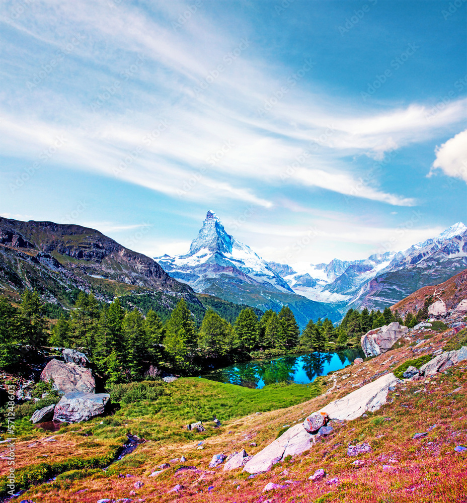 Magical beautiful autumn landscape with fir trees near lake on background Matterhorn in the Swiss Alps, near Zermatt, Switzerland. Amazing places. (Meditation, antistress - concept).