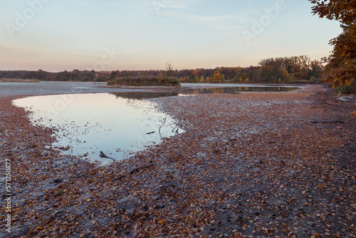 A puddle of water on a drained pond. Landscape.