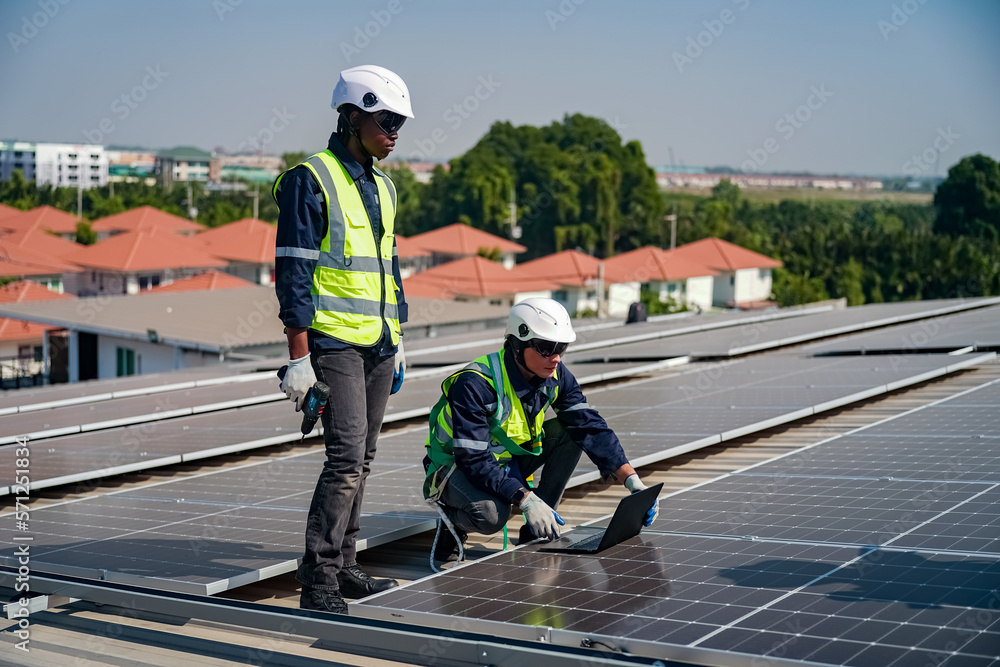 Technology solar cell, Engineer service check installation solar cell on the roof of factory. technician checks the maintenance of the solar panels Technology solar cell, Engineer service check installation solar cell on the roof of factory. technician checks the maintenance of the solar panels