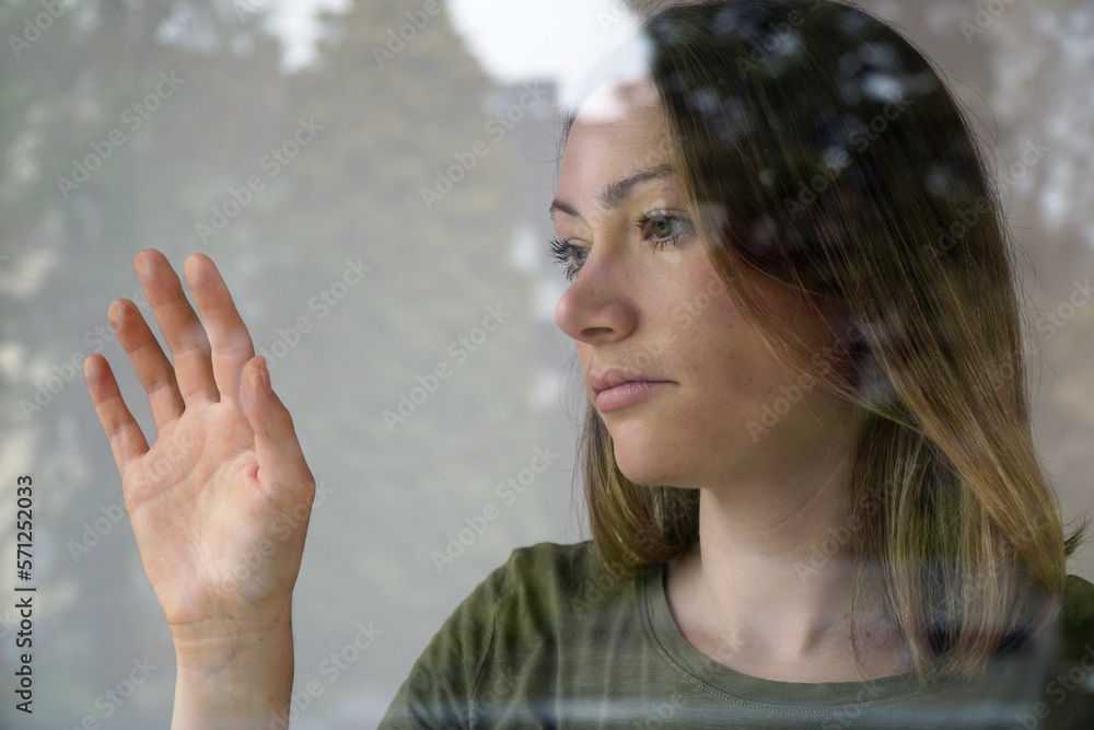 Sad feeling woman suffers from lockdown, social distancing, loneliness and depression