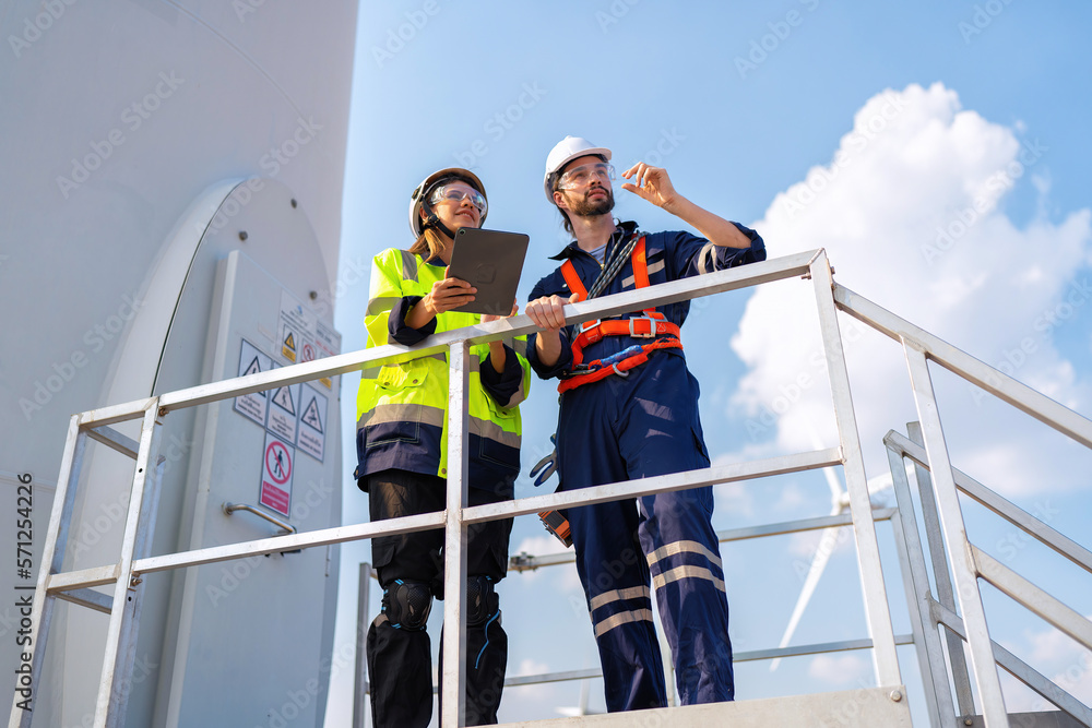 Wind turbine service engineer stand on platform plan for maintenance electricity generator Wind turbine service engineer stand on platform plan for maintenance electricity generator