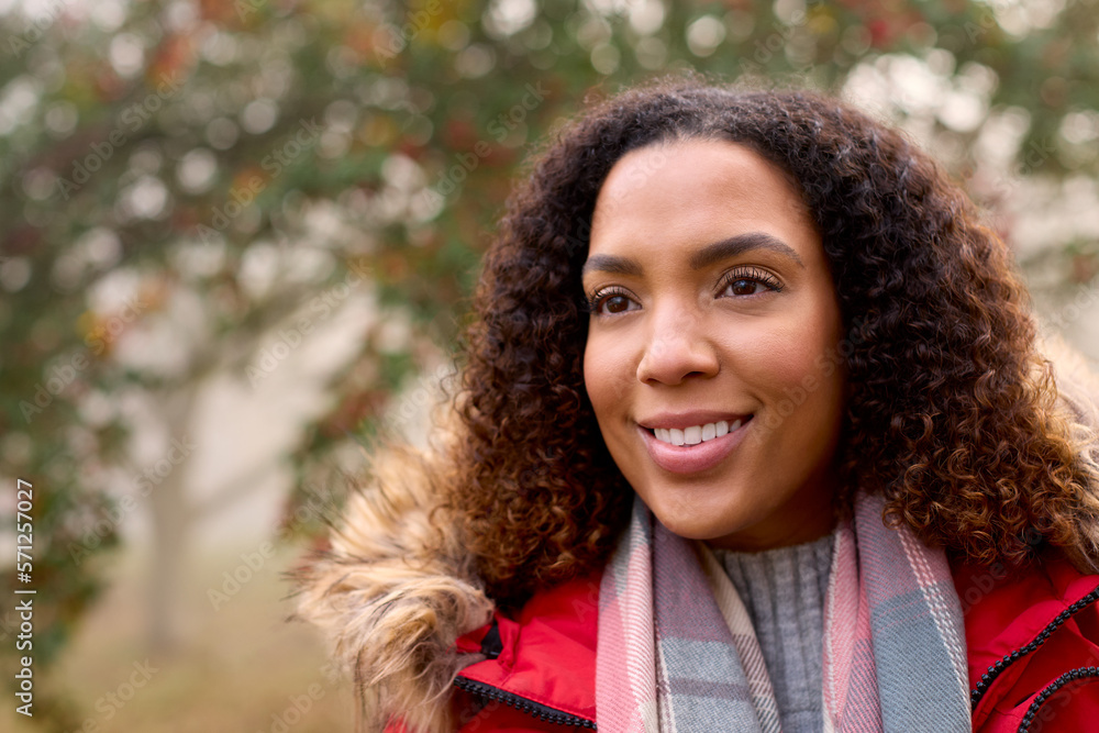 Woman Wearing Coat And Scarf On Walk In Misty Autumn Countryside Woman Wearing Coat And Scarf On Walk In Misty Autumn Countryside