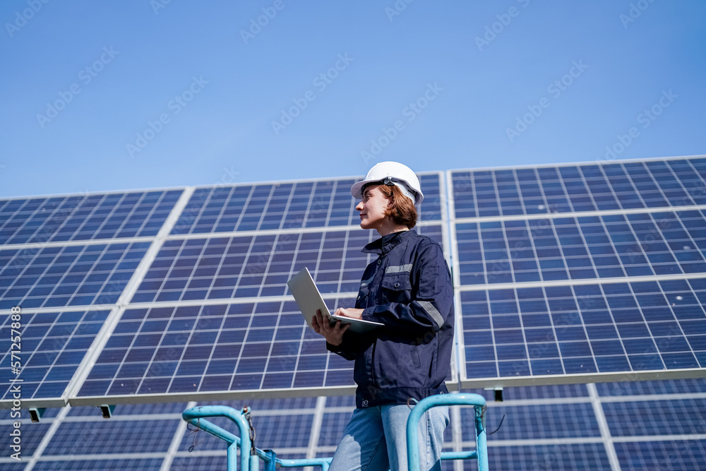 Fototapeta premium Maintenance engineer, Solar energy systems engineer perform analysis solar panels, Engineer service check installation solar cell on the roof of factory. 