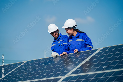 Maintenance engineer, Solar energy systems engineer perform analysis solar panels, Engineer service check installation solar cell on the roof of factory. 