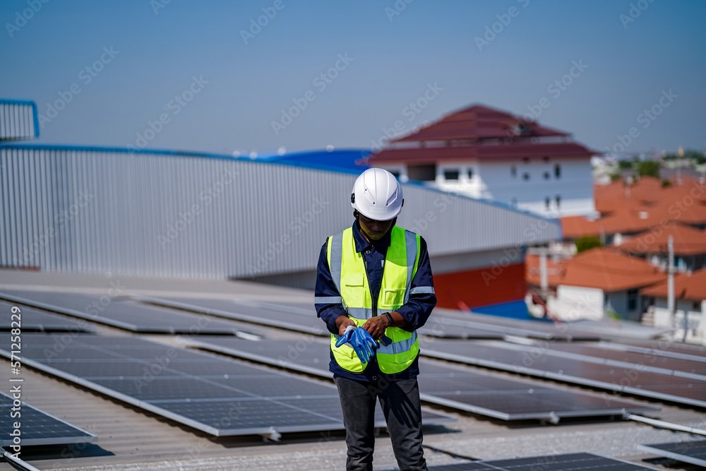 Technology solar cell, Engineer service check installation solar cell on the roof of factory. technician checks the maintenance of the solar panels