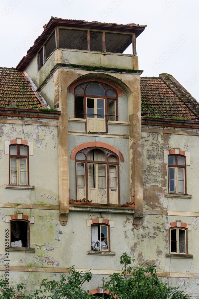 Antique abandoned multi-storey house with tile roof Antique abandoned multi-storey house with tile roof
