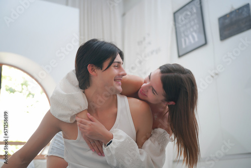 Affectionate young couple in love relaxing at home, having fun.