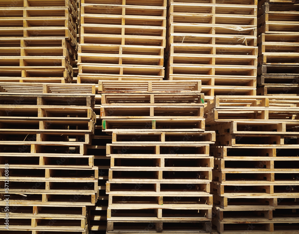 Stacked wooden pallets in warm sunlight Stacked wooden pallets in warm sunlight