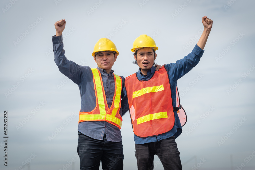 Asian engineers are happy to work together on the project.