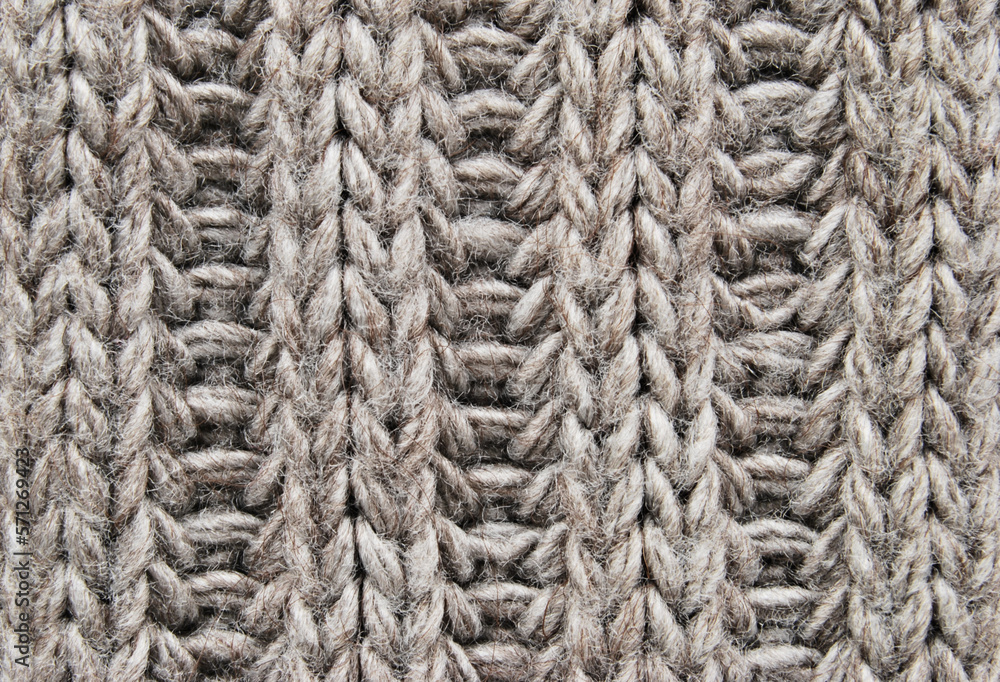Brown ribbed knit fabric pattern close up as background Brown ribbed knit fabric pattern close up as background